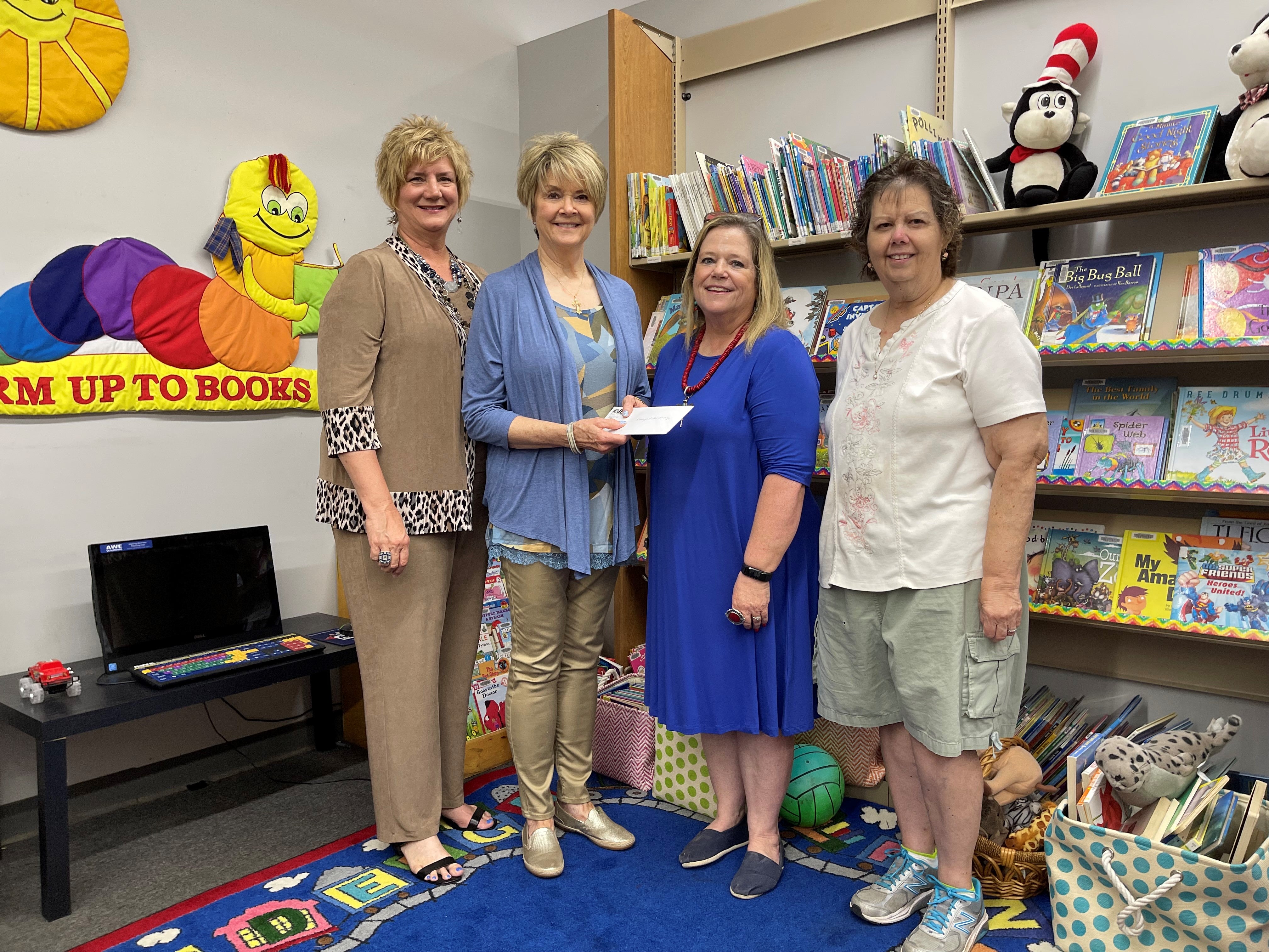 IEC Foundation presents grant to Hominy librarians.